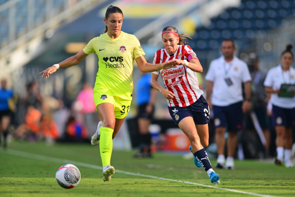 Washington Spirit defender Jenna Butler races for the ball against Guadalajara's Alicia Cervantes in their first NWSL x Liga MX Femenil Summer Cup