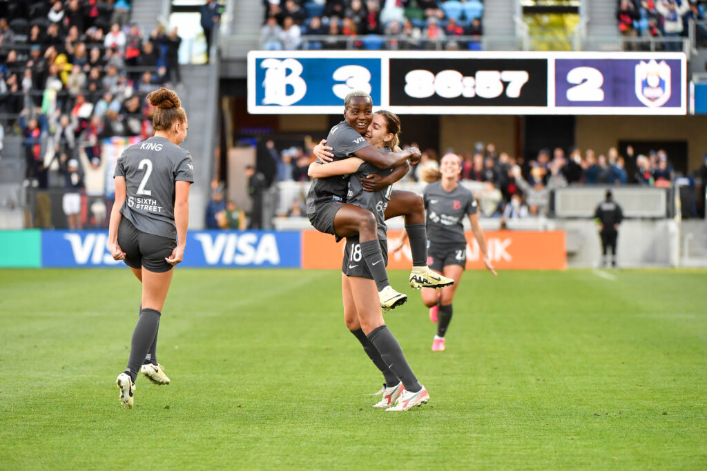 Bay FC players Rachael Kundananj and Joelle Anderson celebrate a goal