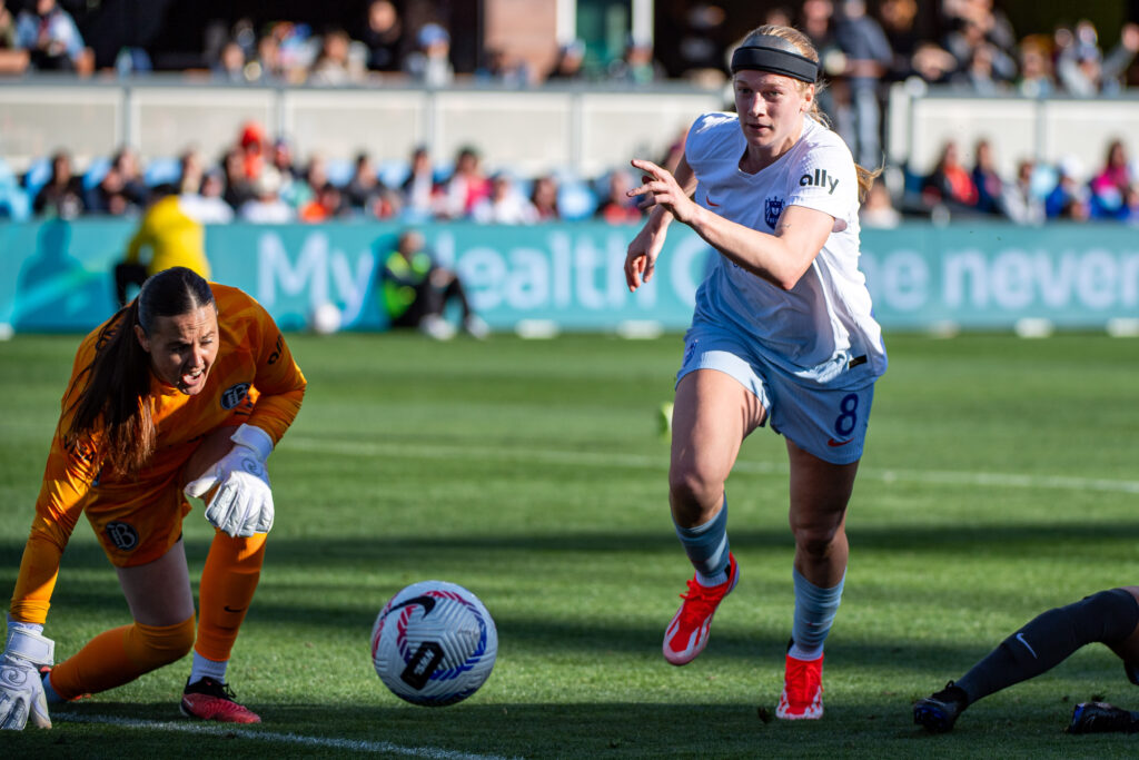 Forward Bethany Balcer chases the ball in a 2024 match