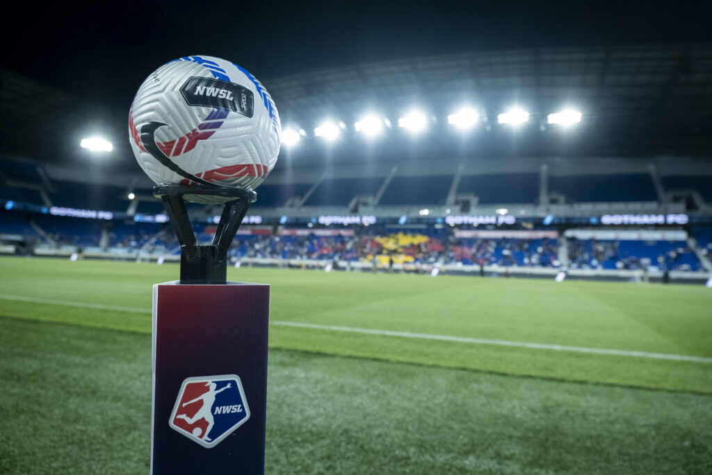 An NWSL game ball sits on a pedestal before a match