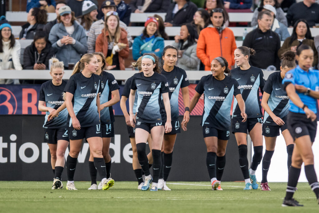 Gotham FC of nwsl players walk across the pitch during a match