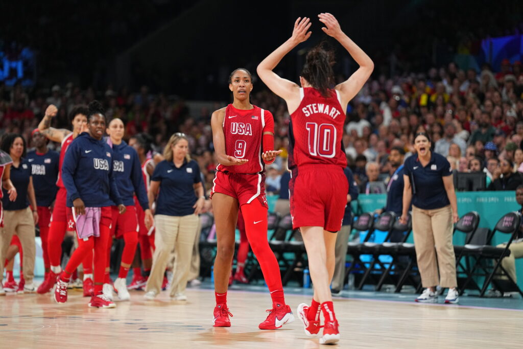 A'ja Wilson and Breanna Stewart high-five in Team USA's Olympic pool play victory over Belgium