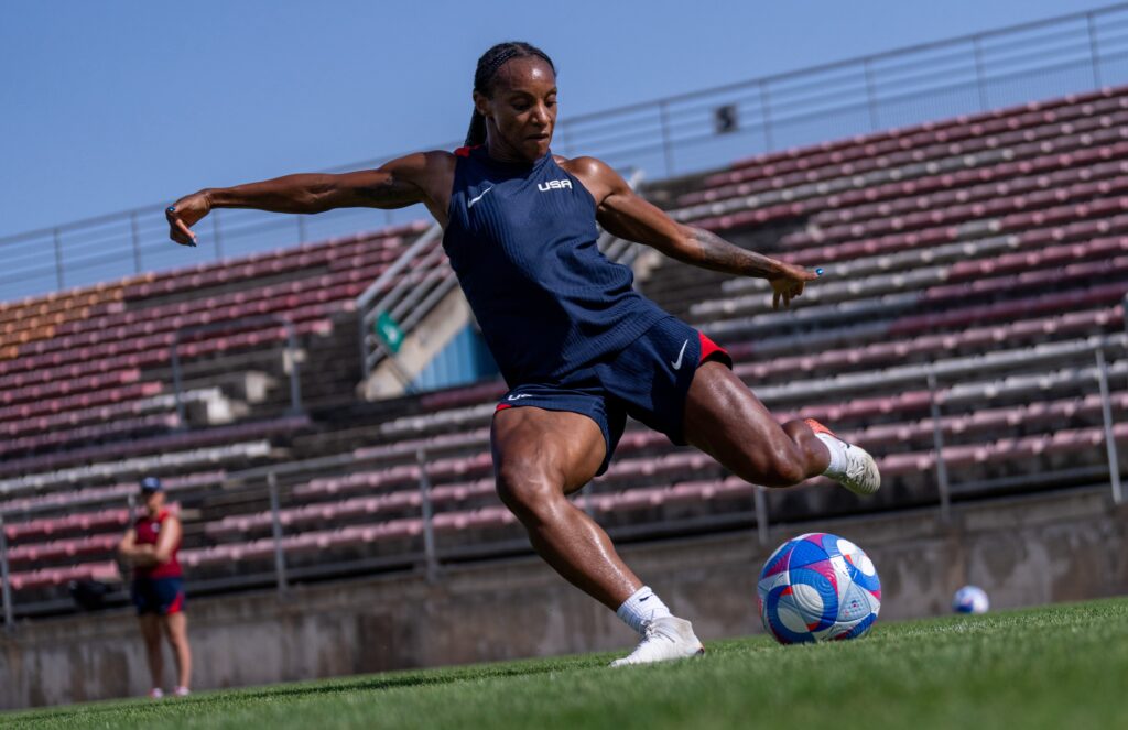 USWNT star Crystal Dunn training on the soccer field during the Olympics