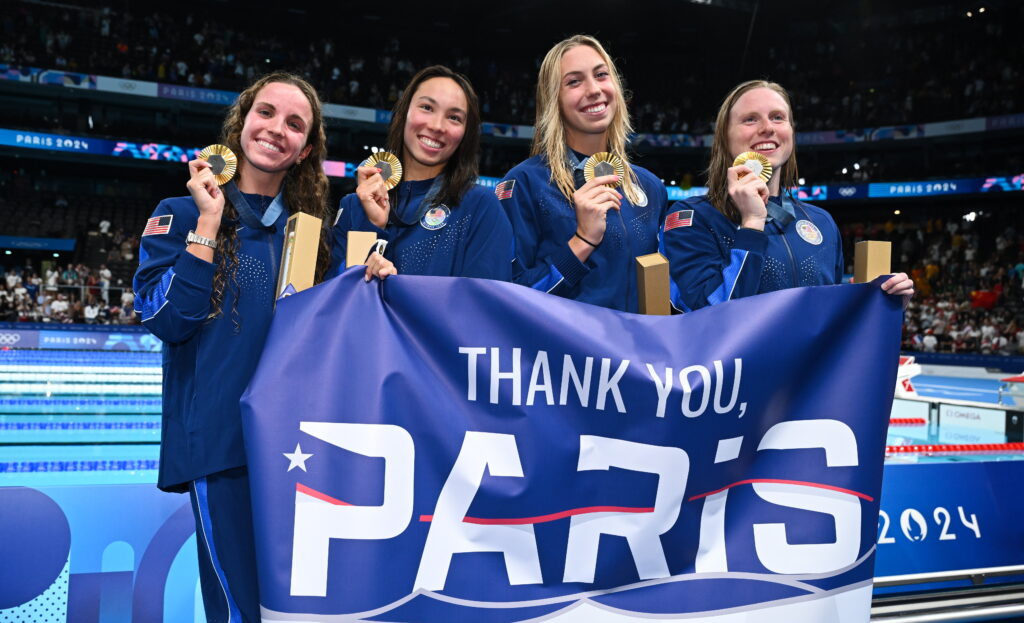 Team USA 4x100 relay teammates Regan Smith, Torri Huske, Gretchen Walsh, and Lilly King with their Olympic gold medals