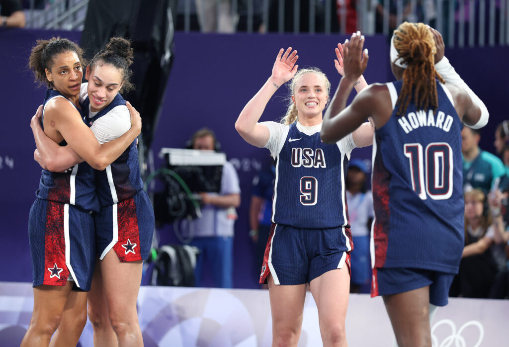 Cierra Burdick, Dearica Hammy, Hailey Van Lith, and Rhyne Howard after winning Olympic bronze for Team USA 3x3 basketball