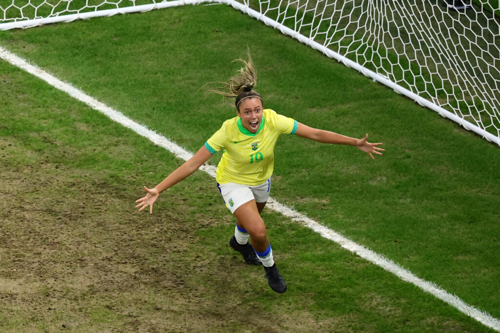 Brazil forward Priscila celebrates after Spain's own goal in the women's semi-final football match between Brazil and Spain during the Paris 2024 Olympic Games