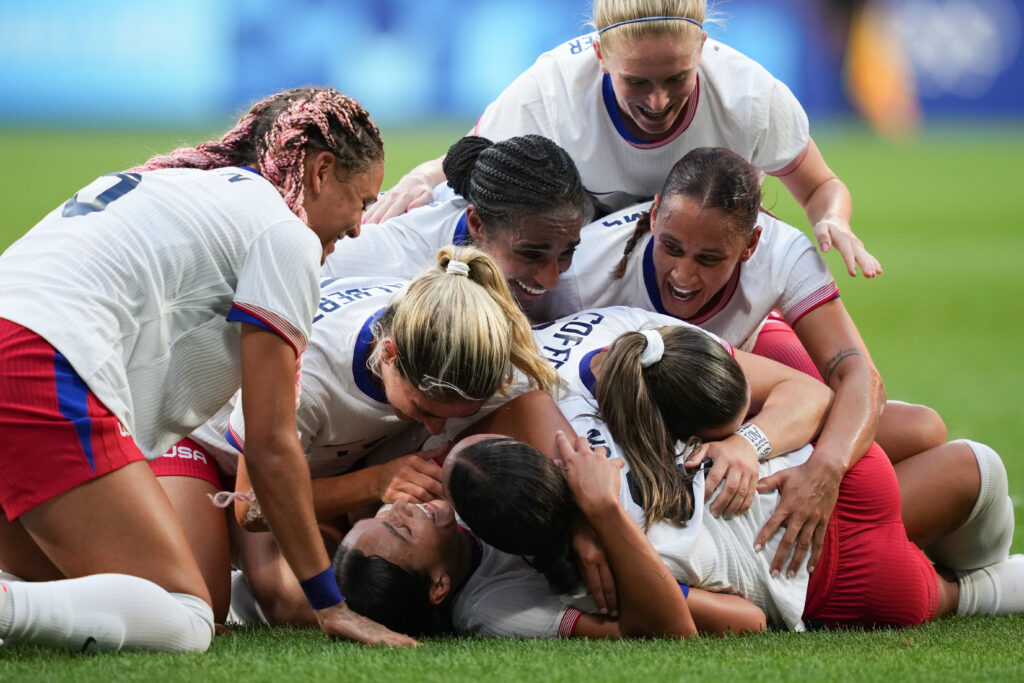 USWNT celebrates Sophia Smith after her game-winning goal in the Olympic semifinal against Germany