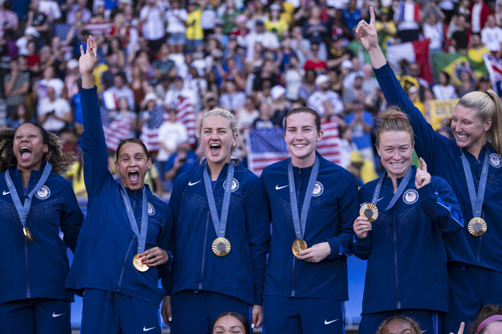 Tierna Davidson and her USWNT teammates celebrate winning the Gold Medal at the Paris Olympics