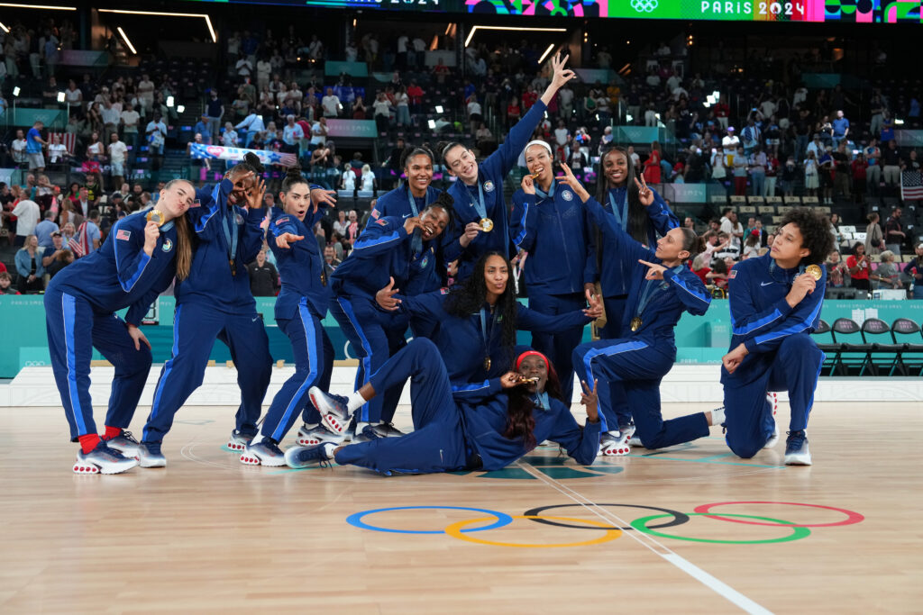 The USA Basketball team poses with their eighth straight Olympic gold medals