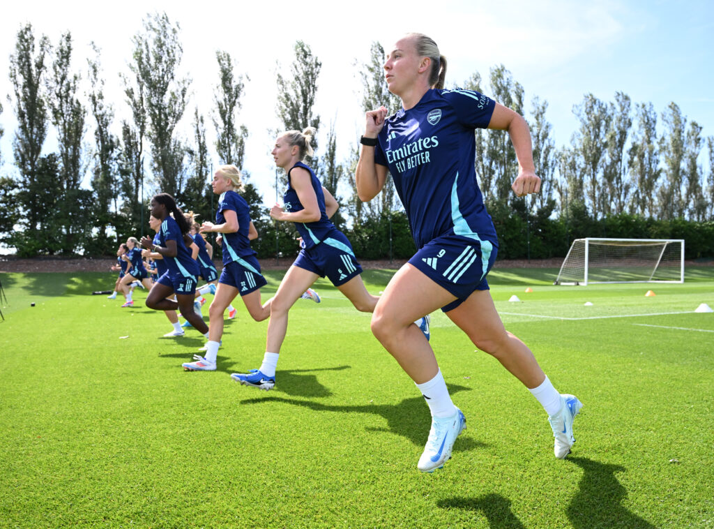 Beth Mead and her Arsenal teammates sprint during training.