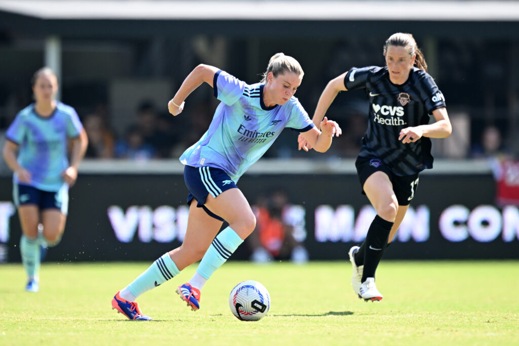 Arsenal's Alessia Russo dribbles past the Washington Spirit's Andi Sullivan of the nwsl