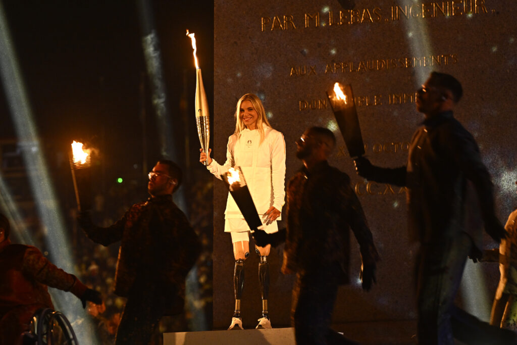 Team USA's Oksana Masters carries in the torch in the 2024 Paris Paralympics Opening Ceremony on Wednesday.