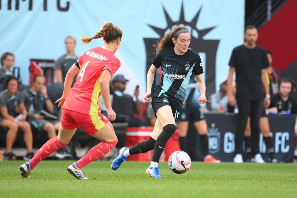 Gotham's Rose Lavelle dribbles around Portland's Becky Sauerbrunn in last weekend's match.