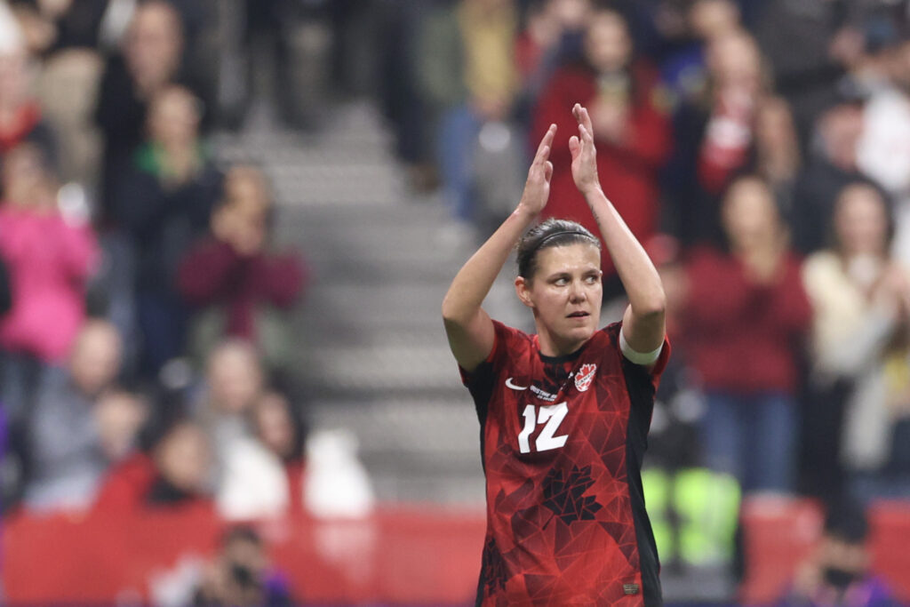 Christine Sinclair applauds the crowd as she exits the pitch in her final international match.