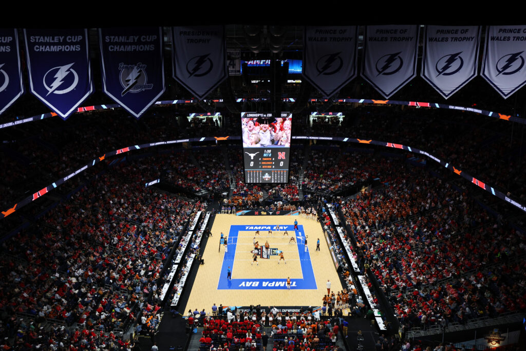 A packed house watches the 2023 NCAA volleyball championship game between Texas and Nebraska.