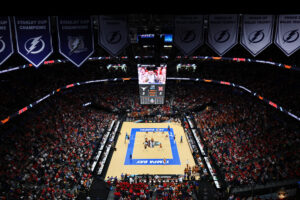 A packed house watches the 2023 NCAA volleyball championship game between Texas and Nebraska.