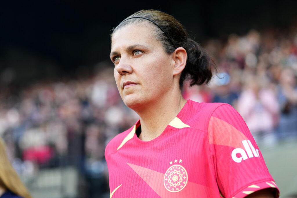 Christine Sinclair walks onto the pitch before a Portland match