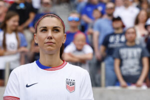 Alex Morgan looks up before a USWNT friendly.