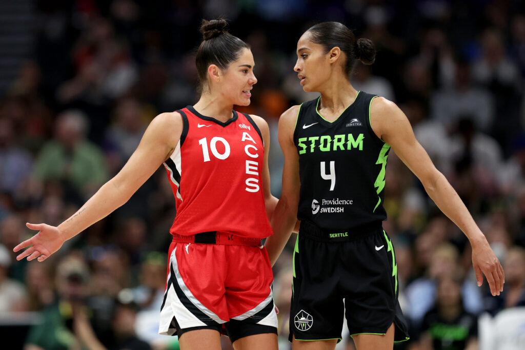 Las Vegas's Kelsey Plum and Seattle's Skylar Diggins-Smith talk during their July WNBA game.