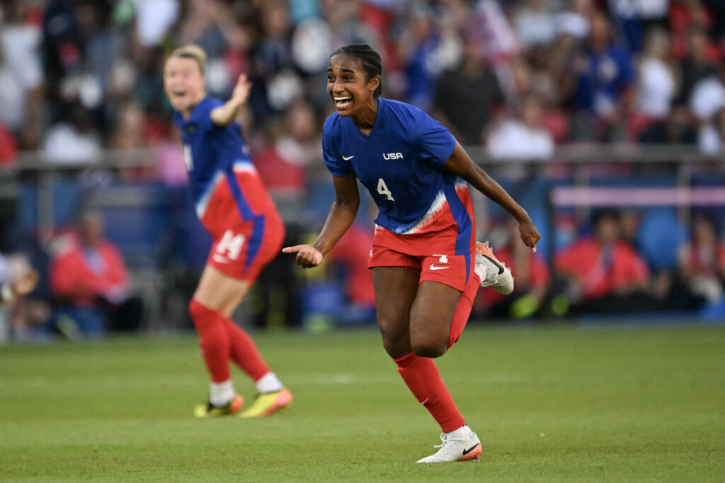 Naomi Girma reacts to her USWNT's 2024 Olympic gold-medal victory.