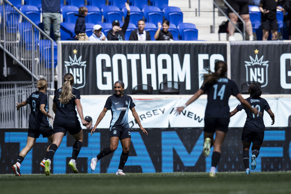 Gotham FC celebrates a goal by midfielder Yazmeen Ryan.