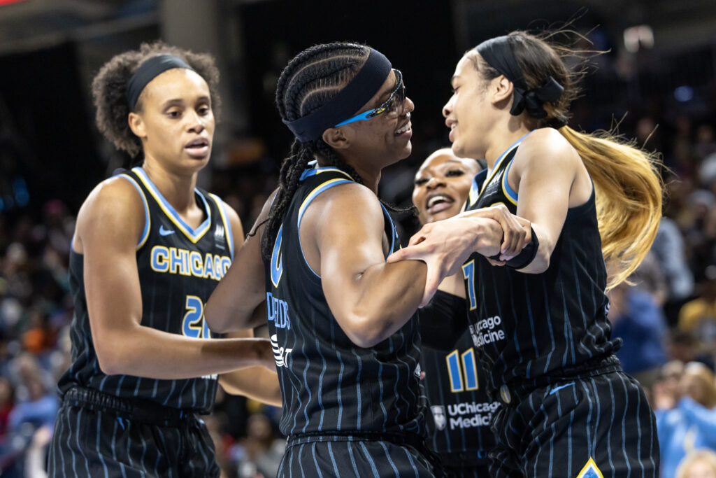 Chicago Sky players celebrate during Sunday's win over Dallas.