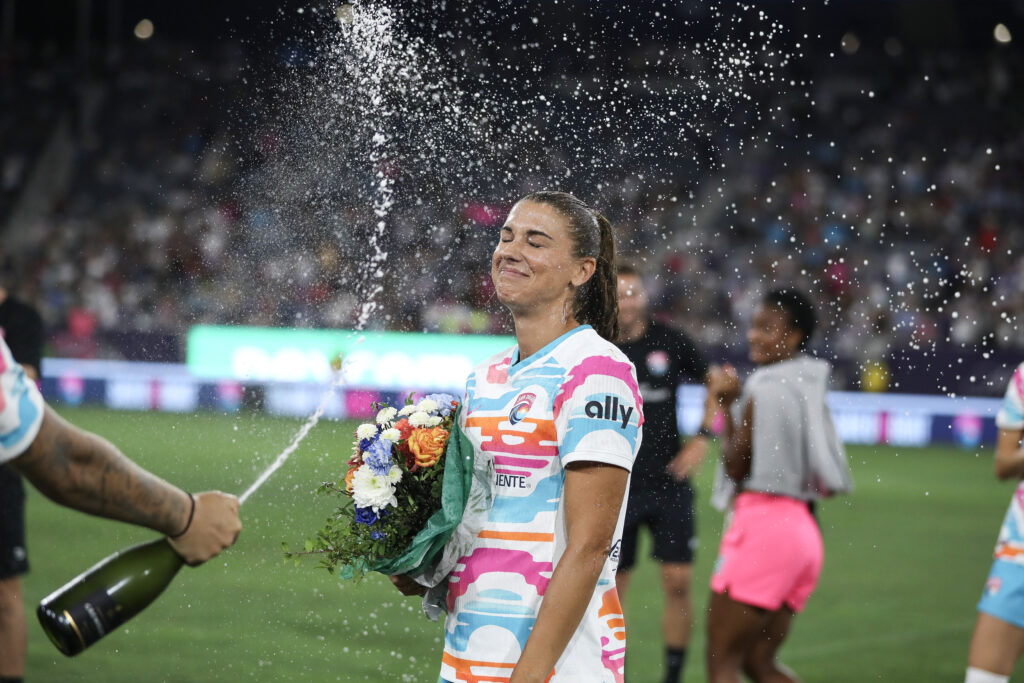 US soccer icon Alex Morgan is sprayed with champagne after her final game on Sunday.