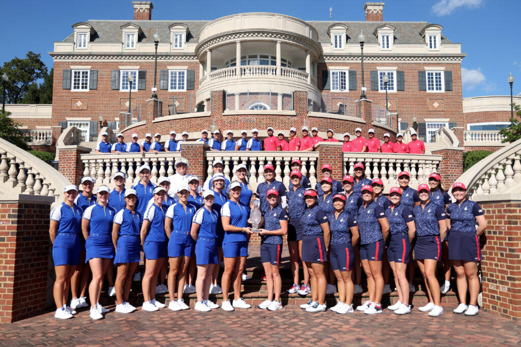 Team Europe and Team USA pose with the Solheim Cup outside the Robert Trent Jones Gold Club.