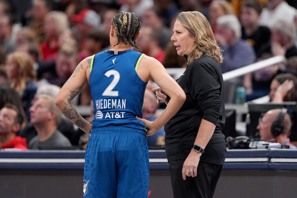 Minnesota Lynx head coach Cheryl Reeve talks to Natisha Hiedeman during a WNBA game against the Indiana Fever at Gainbridge Fieldhouse.