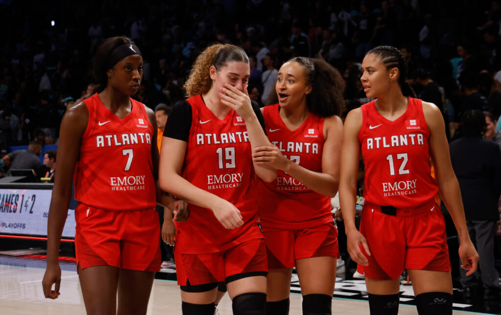 The Atlanta Dream celebrate their 2024 WNBA playoff-clinching victory over New York,