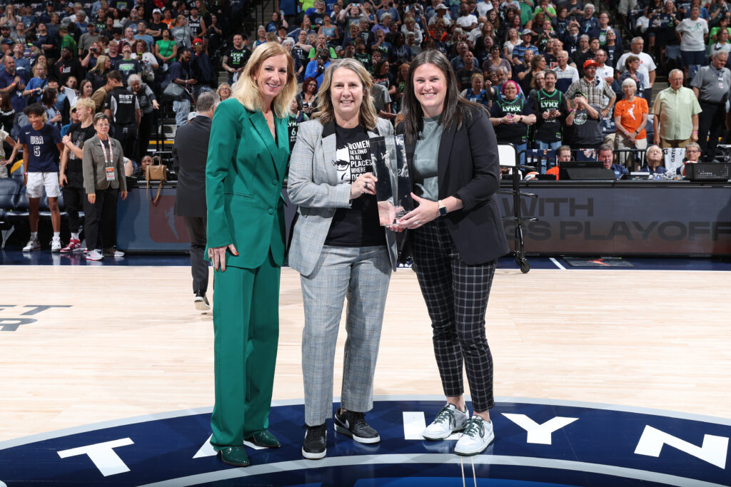 Cheryl Reeve is handed her 2024 WNBA COY award on Sunday.