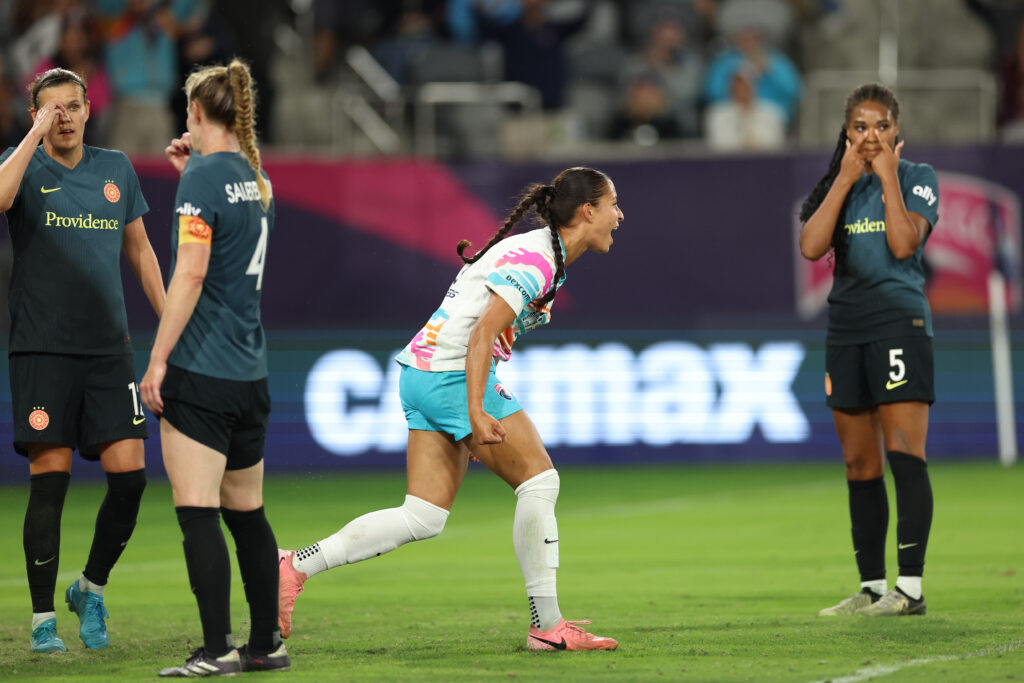 Thorns players look on as San Diego forward Mya Jones celebrates her game-winning goal on Saturday.