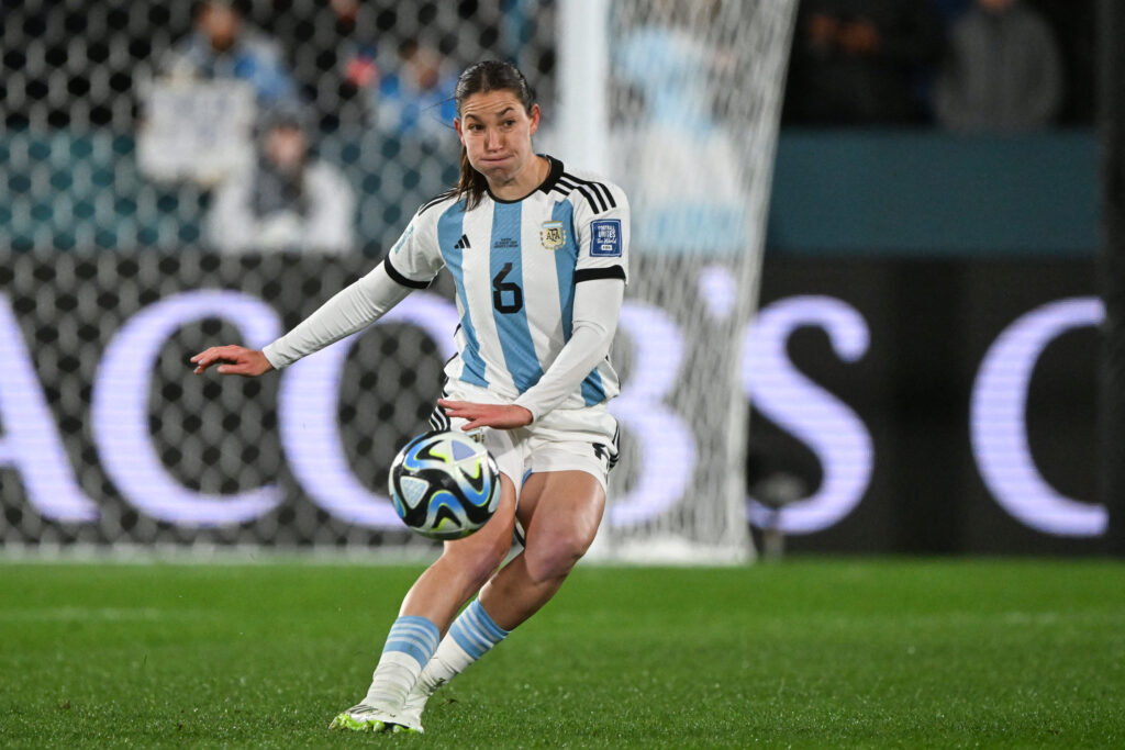 Argentina defender Aldana Cometti crosses the ball during a 2023 World Cup match.