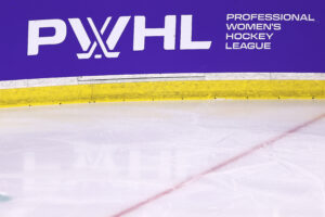 The PWHL logo is displayed on the boards during a January 2024 game.