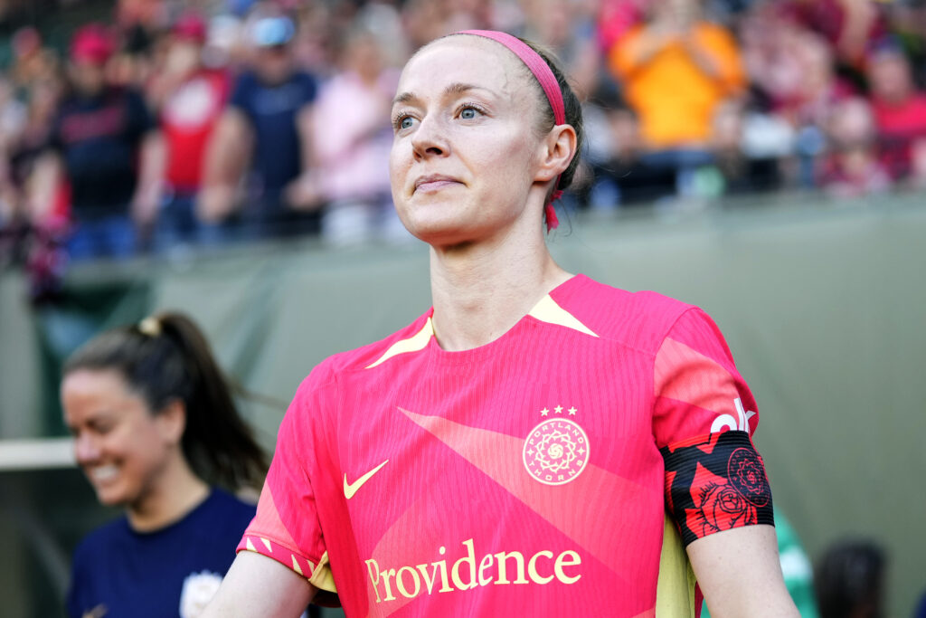 USWNT icon and and FIFA-Aramco letter activist Becky Sauerbrunn walks onto the pitch for an NWSL match.