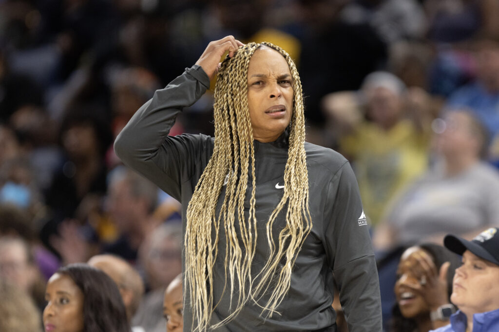 Former Chicago Sky head coach Teresa Weatherspoon scratches her head while complaining about a call.