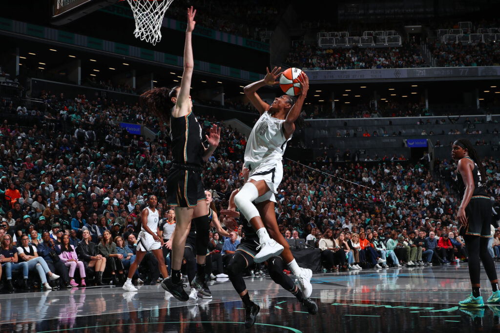 Las Vegas guard Tiffany Hayes attempts a lay-up against the Liberty's Breanna Stewart.