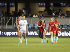 Kansas City Current midfielder Lo'eau Labonta congratulates forward Temwa Chawinga during an NWSL game against Bay FC