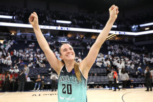 New York's Sabrina Ionescu raises her arms in celebration after WNBA Finals Game 3.