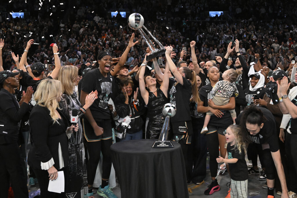 The NY Liberty lift their 2024 WNBA Championship trophy