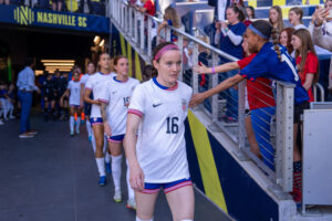 USWNT midfielder Rose Lavelle walks onto the pitch.