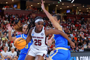 South Carolina's Raven Johnson drives past UCLA's Londynn Jones to the basket.