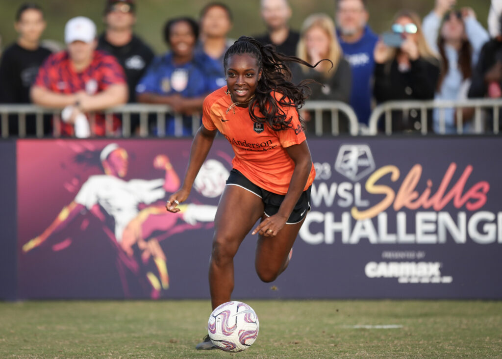 Houston Dash forward Michelle Alozie dribbles the ball at the 2023 NWSL Skills Challenge.