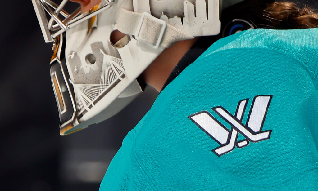 A close-up of the PWHL logo on a New York Sirens jersey.