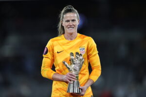 USWNT star Alyssa Naeher holds her Concacaf W Gold Cup Gold Gloves trophy as the tournament's Best Goalkeeper.