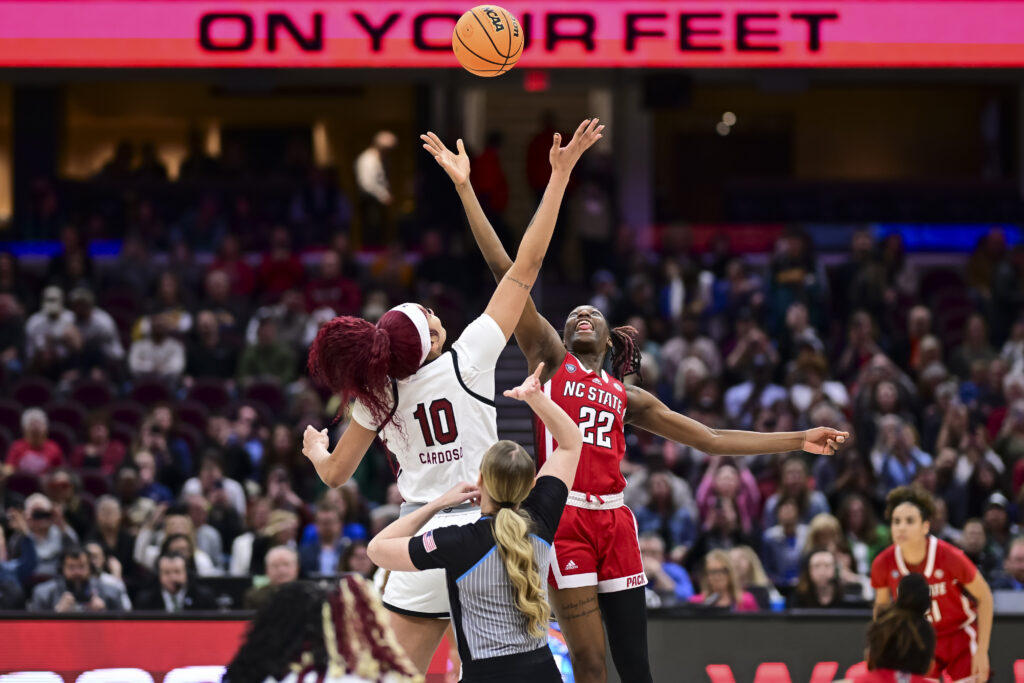 Former South Carolina star Kamila Cardoso and NC State's Saniya Rivers tip off in a college basketball game at the 2024 NCAA Final Four semifinal.