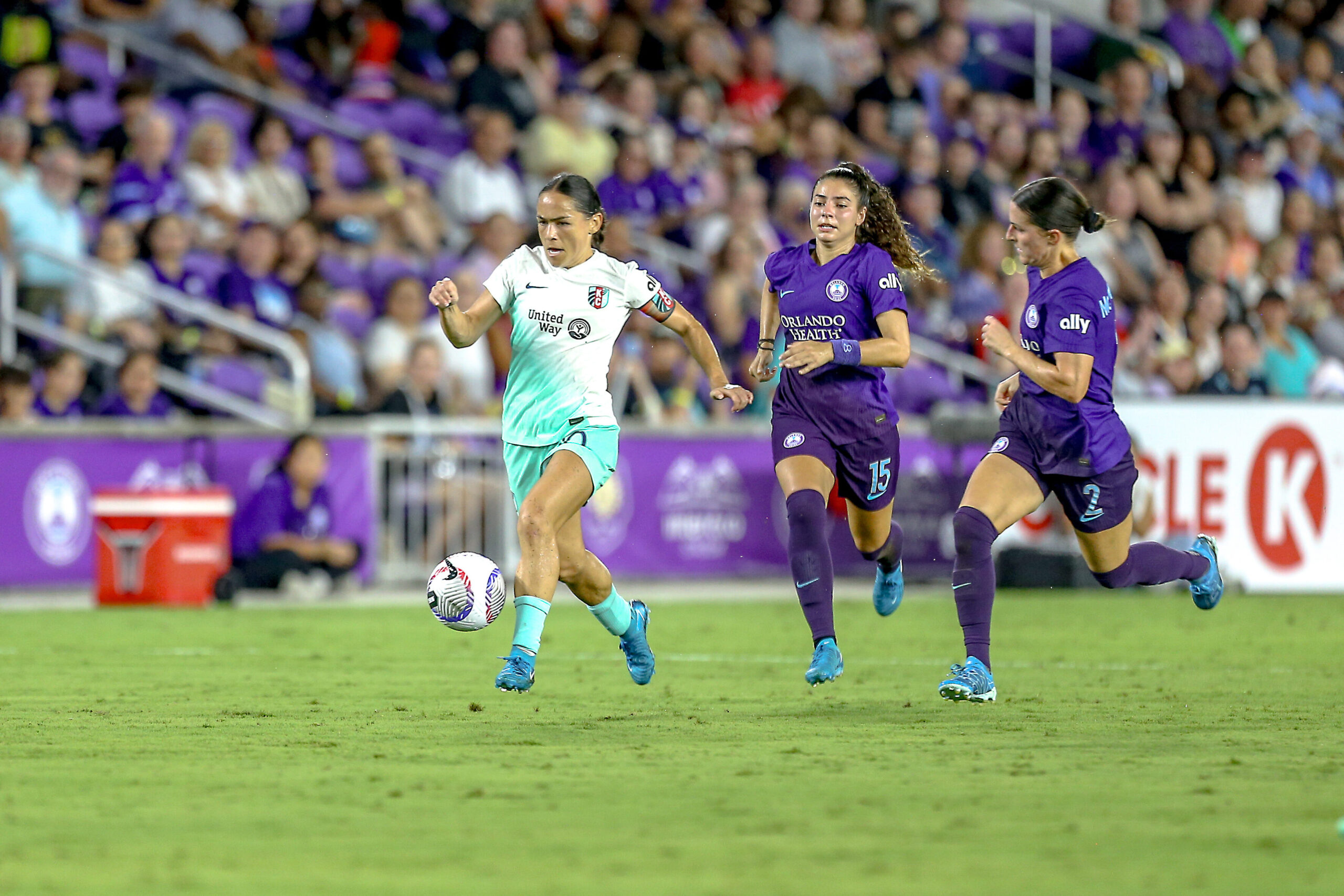 Orlando's Haley McClutcheon and Angelina try to chase down Kansas City's Lo LaBonta in an NWSL game.