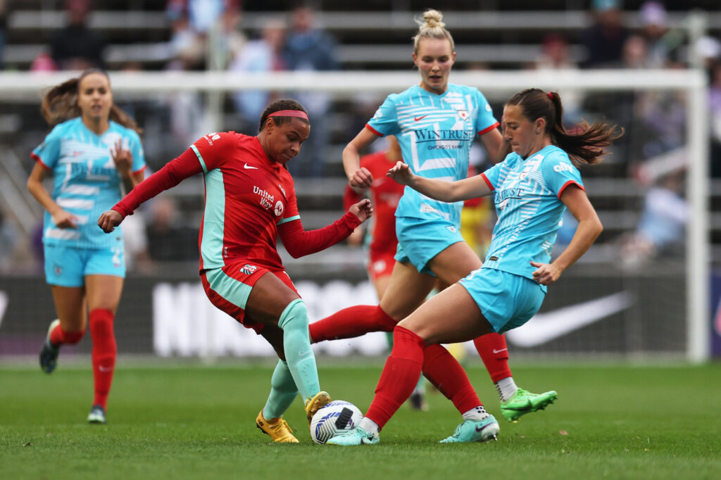 KC's Michelle Cooper battles Chicago's Hannah Anderson for the ball during an NWSL match.