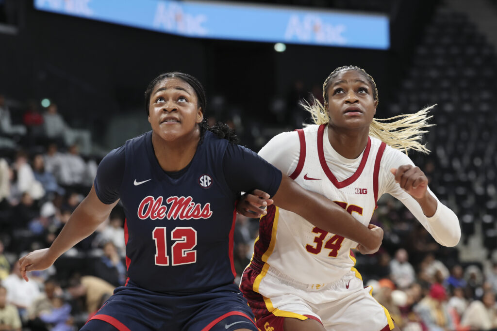 Ole Miss's Christeen Iwuala and USC's Clarice Akunwafo eye a rebound during their 2024/25 season opener.