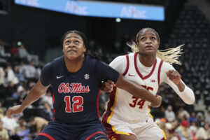 Ole Miss's Christeen Iwuala and USC's Clarice Akunwafo eye a rebound during their 2024/25 season opener.